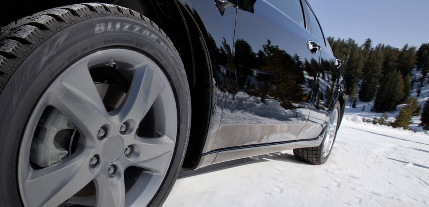 Winter Snow Tire on a Car Image
